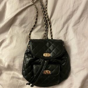 Black quilted leather gold chain mini backpack